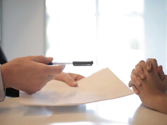Two people having an insurance contract discussion